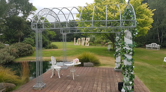 Outdoor wedding arch and table setting